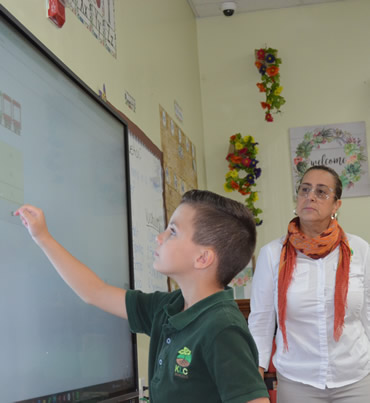Elementary students in class at Kids Learning Center